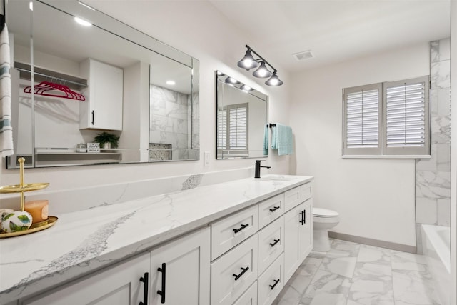 bathroom with vanity and toilet