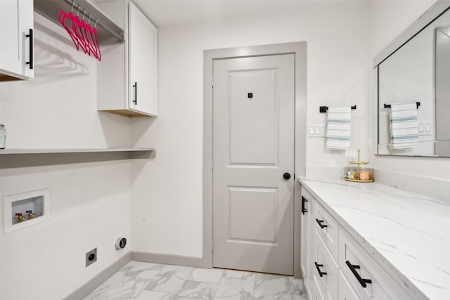 laundry area featuring electric dryer hookup, cabinets, and washer hookup