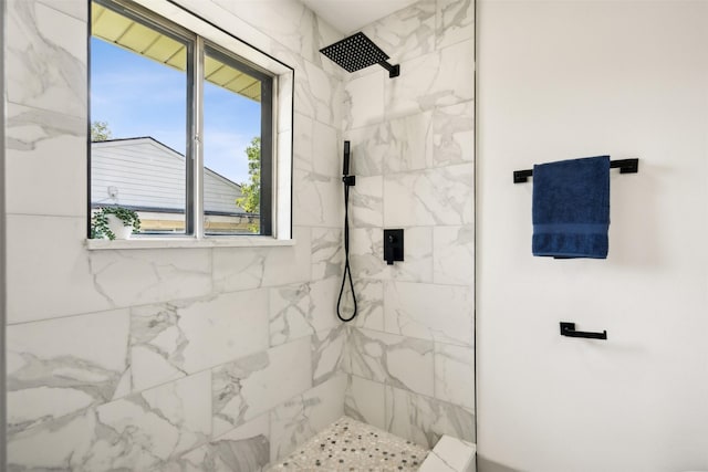 bathroom with tiled shower