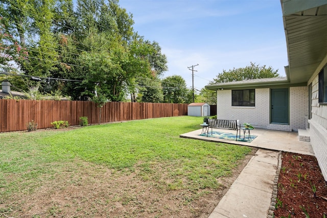 view of yard with a shed and a patio