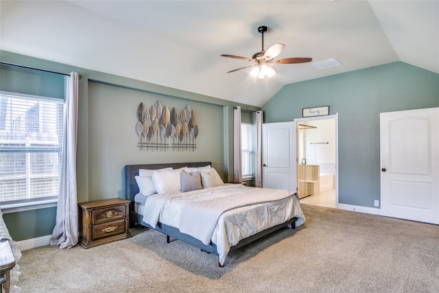 bedroom with lofted ceiling, ceiling fan, ensuite bathroom, and carpet flooring