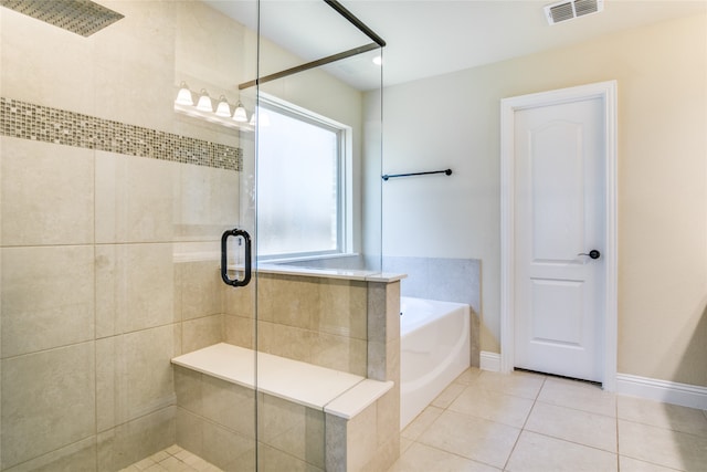 bathroom featuring separate shower and tub and tile patterned floors