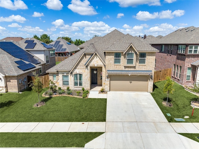 view of front of house featuring a garage and a front yard