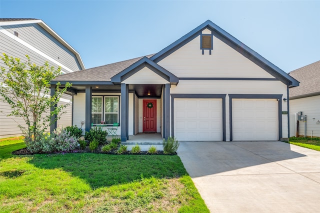 view of front of property with a garage, a porch, and a front lawn