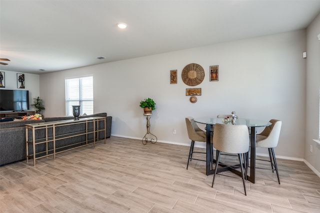 dining space featuring light hardwood / wood-style floors