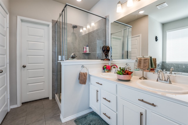 bathroom with vanity, tile patterned floors, and an enclosed shower