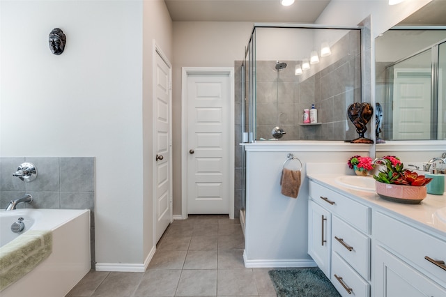 bathroom with plus walk in shower, tile patterned floors, and vanity