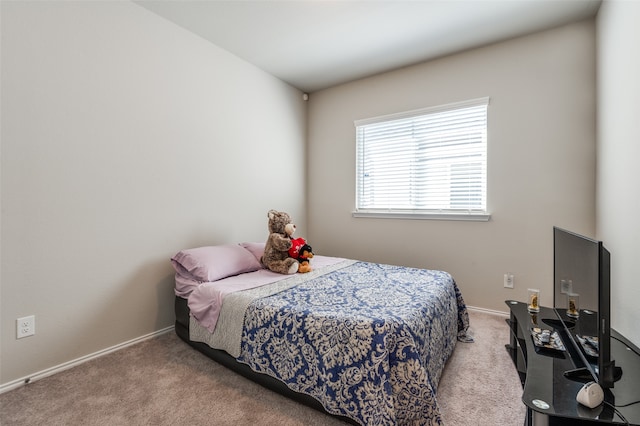 bedroom with light colored carpet