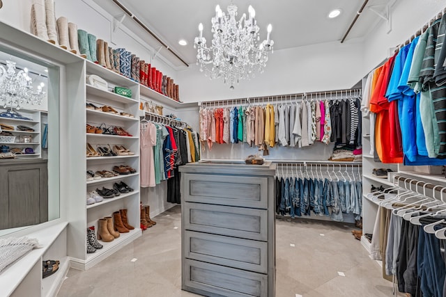 spacious closet with a notable chandelier