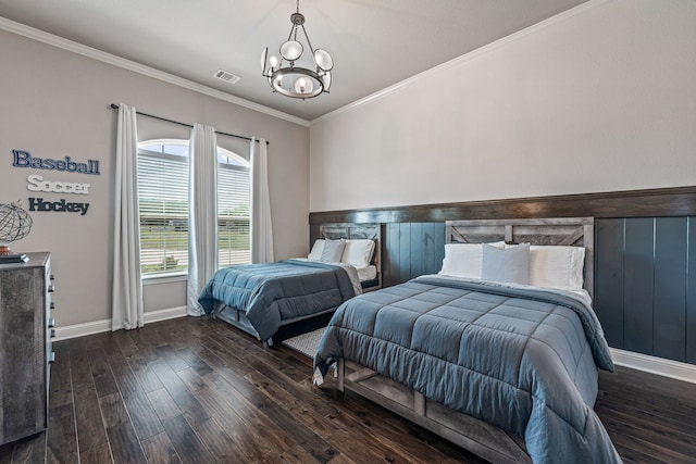 bedroom featuring a notable chandelier, dark wood-type flooring, and crown molding