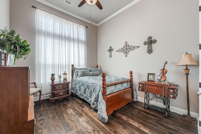 bedroom with ornamental molding, ceiling fan, and dark wood-type flooring