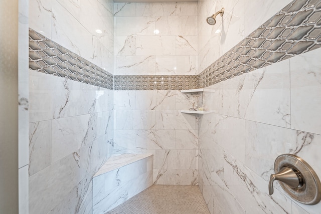 bathroom featuring tiled shower