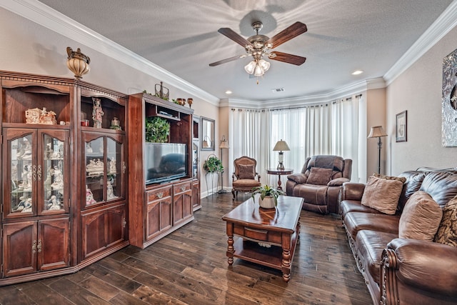 living room with a textured ceiling, crown molding, dark wood-type flooring, and ceiling fan