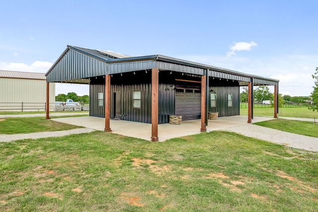 exterior space featuring a yard and an outbuilding