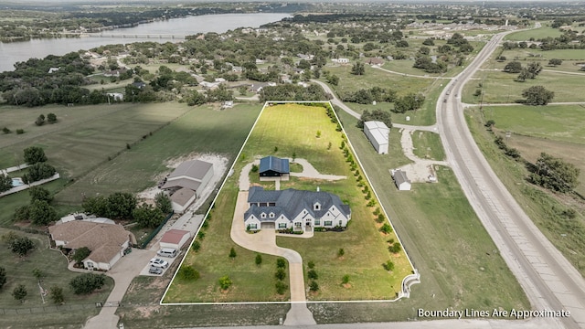 bird's eye view with a water view and a rural view