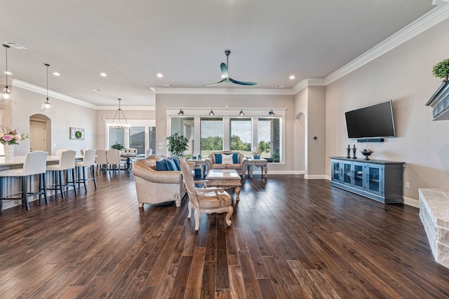 living room featuring ornamental molding and dark hardwood / wood-style flooring