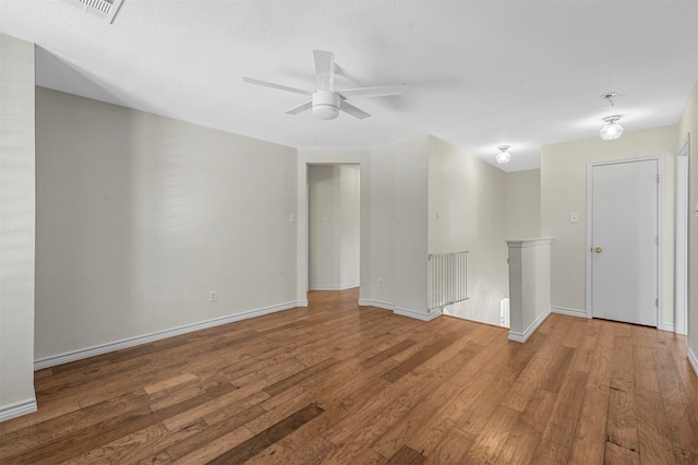 unfurnished room featuring hardwood / wood-style floors and ceiling fan