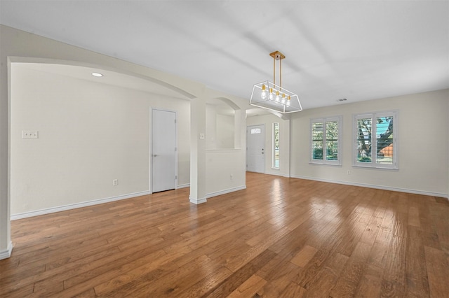 unfurnished living room with light hardwood / wood-style floors