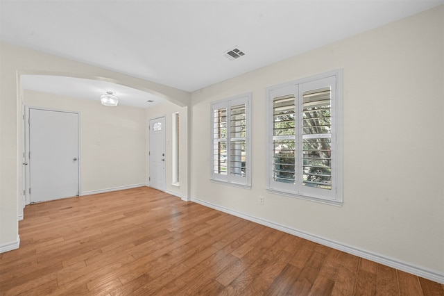 spare room featuring light hardwood / wood-style floors