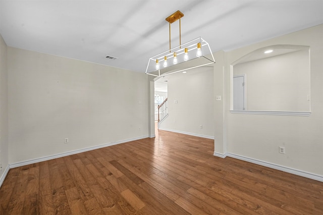 empty room featuring hardwood / wood-style flooring