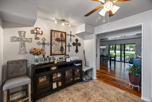 interior space with ceiling fan and hardwood / wood-style floors