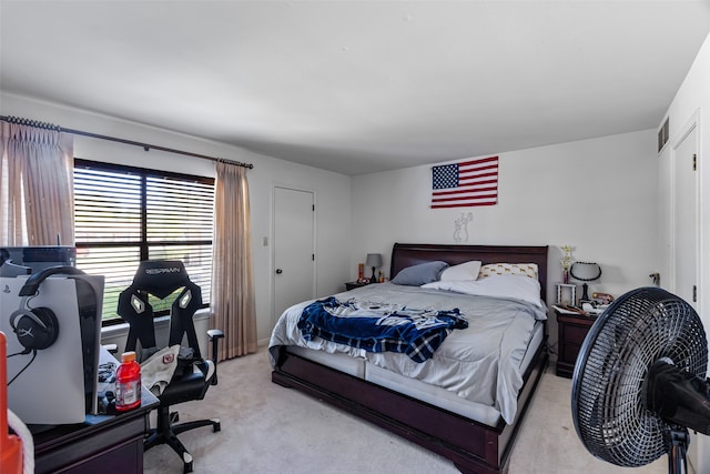 bedroom featuring light colored carpet