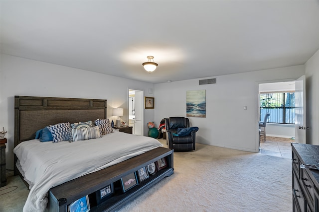 bedroom featuring light colored carpet