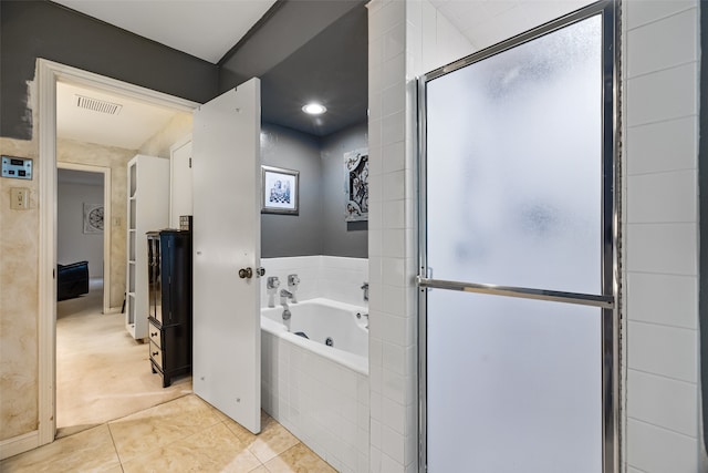 bathroom featuring plus walk in shower and tile patterned floors