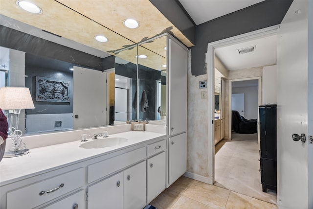 bathroom featuring tile patterned flooring and vanity