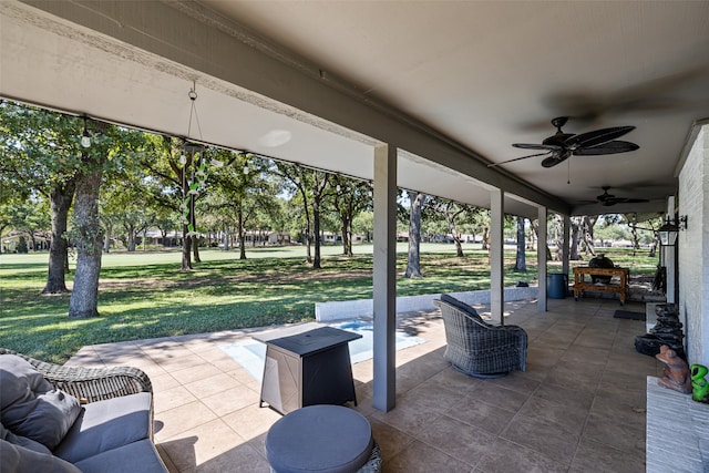 view of patio featuring ceiling fan