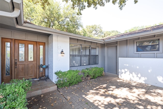 property entrance with a patio area