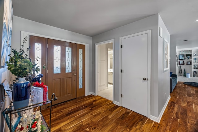 foyer with dark hardwood / wood-style flooring