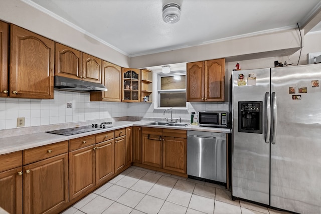 kitchen with light tile patterned floors, stainless steel appliances, sink, and decorative backsplash