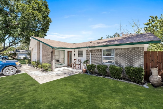 ranch-style home featuring a front yard