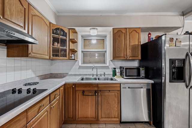 kitchen featuring decorative backsplash, appliances with stainless steel finishes, extractor fan, and sink