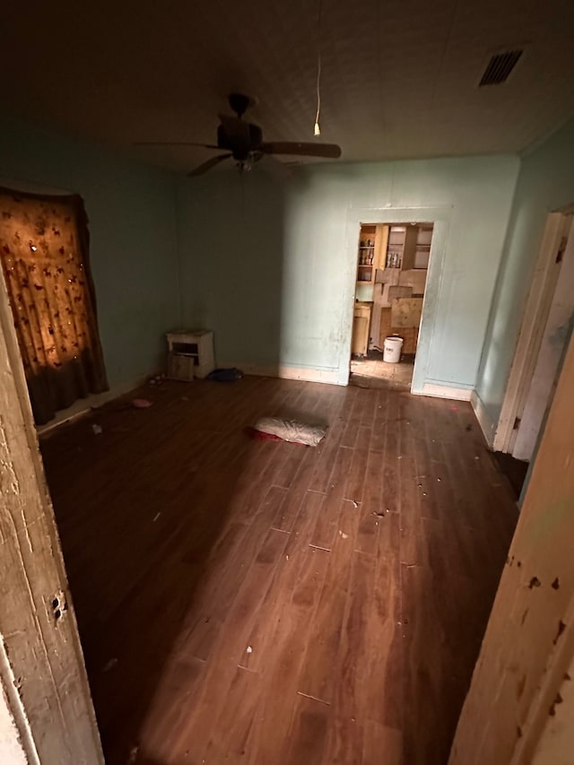 interior space with dark hardwood / wood-style floors and ceiling fan