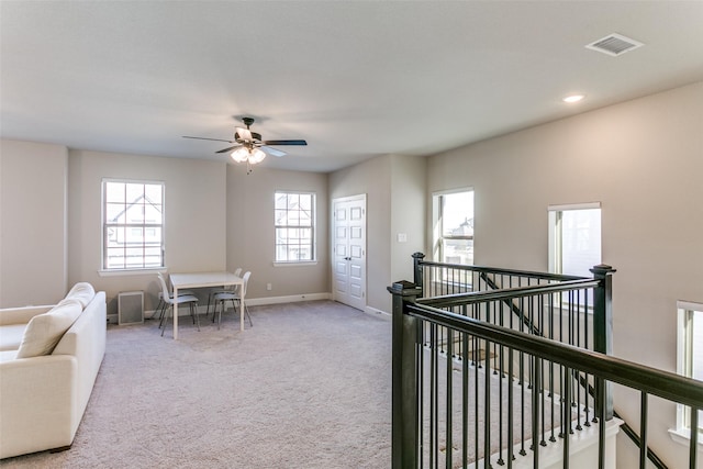 interior space with recessed lighting, carpet flooring, baseboards, and visible vents