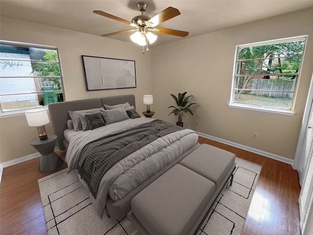 bedroom featuring hardwood / wood-style floors and ceiling fan