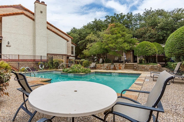 view of swimming pool featuring a patio