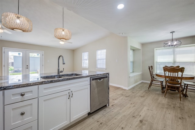 kitchen with ceiling fan, hanging light fixtures, stainless steel dishwasher, and sink