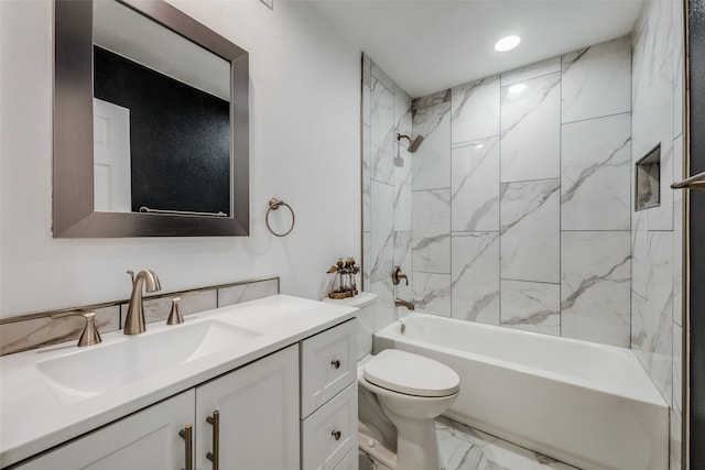 full bathroom with vanity, tiled shower / bath combo, and toilet