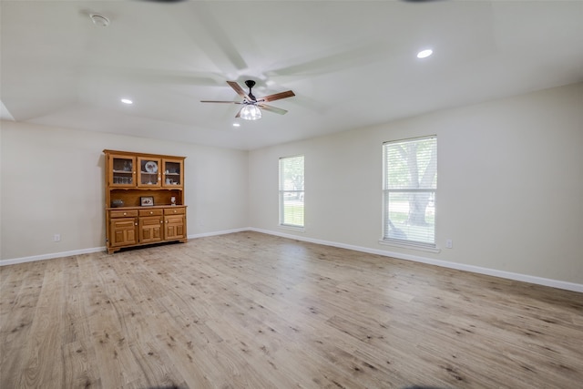 spare room featuring ceiling fan and light hardwood / wood-style floors