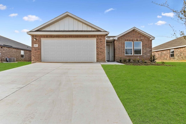 view of front facade featuring central AC unit, a garage, and a front yard