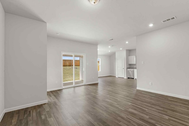 unfurnished living room featuring dark hardwood / wood-style floors