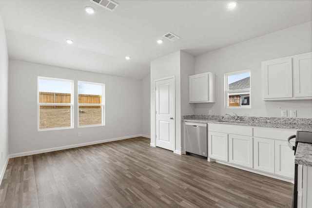 kitchen featuring sink, dark wood-type flooring, light stone counters, white cabinets, and stainless steel dishwasher