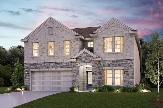 view of front of property featuring a garage and a lawn