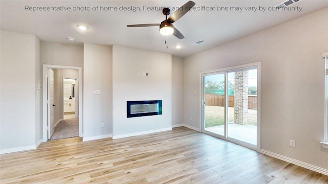 unfurnished living room featuring ceiling fan and light hardwood / wood-style floors