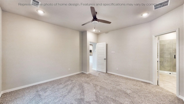 spare room featuring ceiling fan and carpet