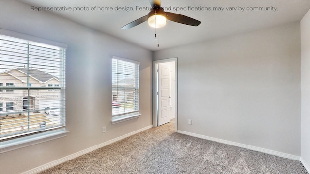 carpeted empty room with ceiling fan