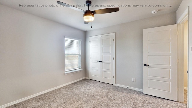 unfurnished bedroom with ceiling fan, light colored carpet, and a closet